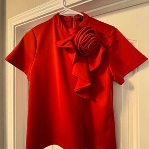 Elegant Red Women's Top with Floral Accent